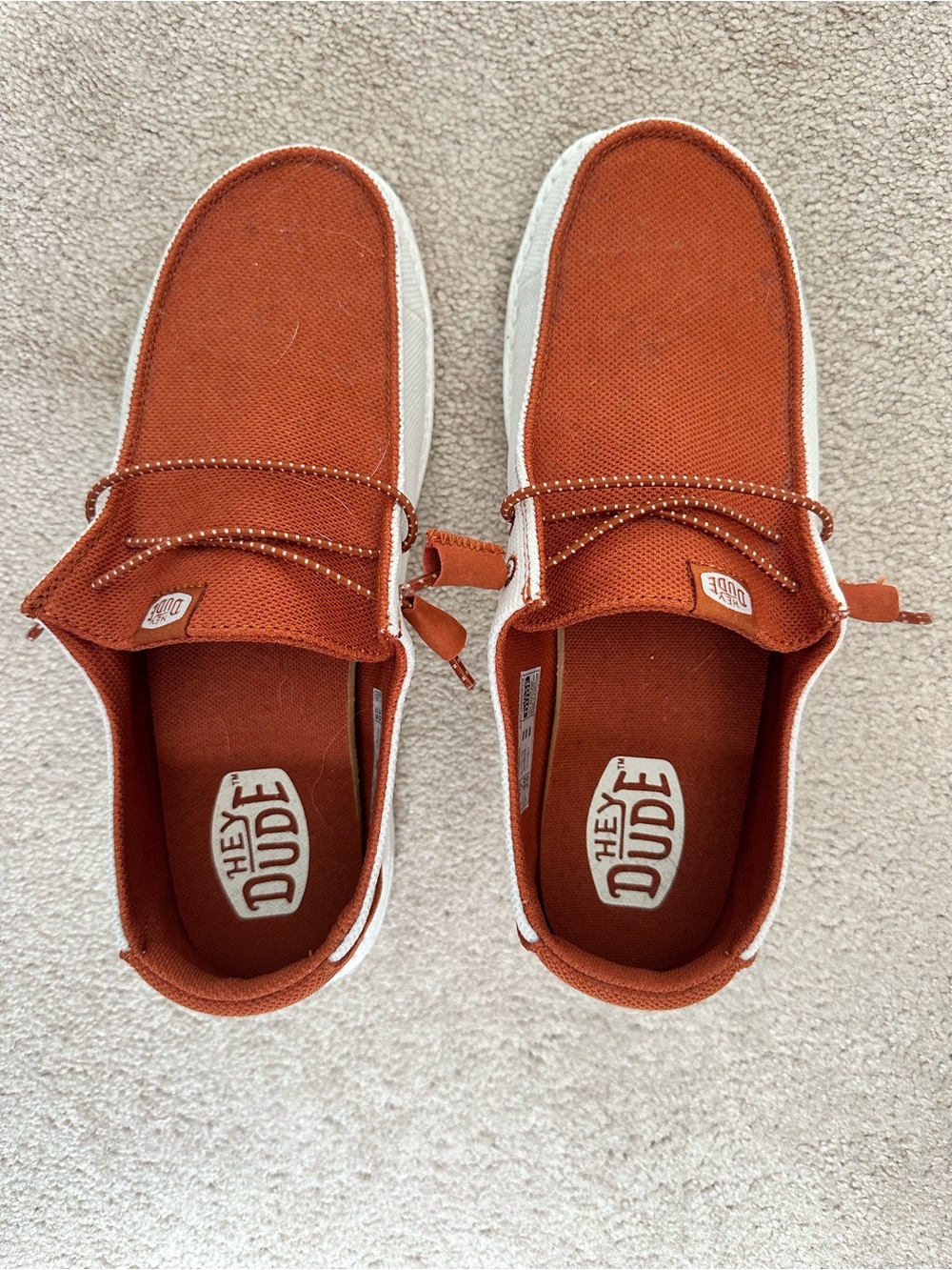 Hey Dude women’s Rust Orange Canvas Slip-On Sneakers